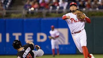 Sep 16, 2016; Philadelphia, PA, USA; Philadelphia Phillies shortstop Freddy Galvis (13) throws for a double play after tagging out Miami Marlins catcher J.T. Realmuto (11) fifth inning at Citizens Bank Park. Mandatory Credit: Bill Streicher-USA TODAY Sports