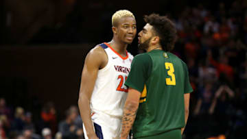 CHARLOTTESVILLE, VA - NOVEMBER 19: Mamadi Diakite #25 of the Virginia Cavaliers and Anthony Lamb #3 of the Vermont Catamounts talk in the second half during a game at John Paul Jones Arena on November 19, 2019 in Charlottesville, Virginia. (Photo by Ryan M. Kelly/Getty Images)