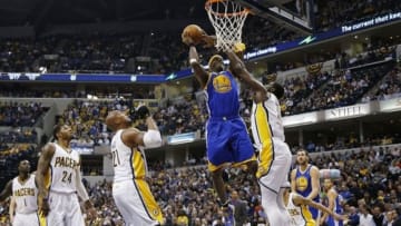 Mar 4, 2014; Indianapolis, IN, USA; Golden State Warriors center Jermaine O'Neal (7) takes a shot against Indiana Pacers center Roy Hibbert (55) at Bankers Life Fieldhouse. Mandatory Credit: Brian Spurlock-USA TODAY Sports