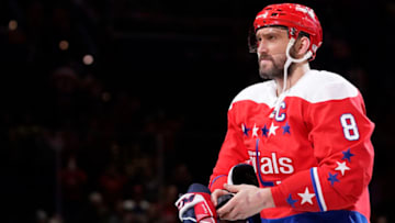 WASHINGTON, DC - JANUARY 16: Alex Ovechkin #8 of the Washington Capitals prepares to throw a puck to a fan after the Capitals defeated the New Jersey Devils 5-2 at Capital One Arena on January 16, 2020 in Washington, DC. (Photo by Patrick McDermott/NHLI via Getty Images)