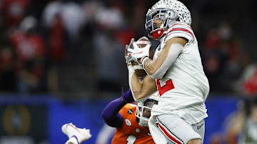 Ohio State Buckeyes wide receiver Chris Olave (2) makes a touchdown catch against Clemson Tigers cornerback Derion Kendrick (1) in the third quarter during the College Football Playoff semifinal at the Allstate Sugar Bowl in the Mercedes-Benz Superdome in New Orleans on Friday, Jan. 1, 2021.College Football Playoff Ohio State Faces Clemson In Sugar Bowl