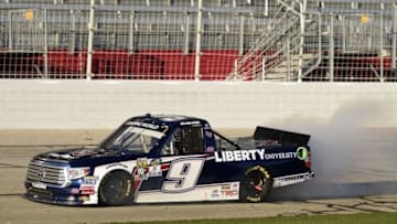 Feb 27, 2016; Hampton, GA, USA; NASCAR Camping World Truck Series driver William Byron (9) smokes out through the front stretch during the Georgia 200 at Atlanta Motor Speedway. Mandatory Credit: John David Mercer-USA TODAY Sports