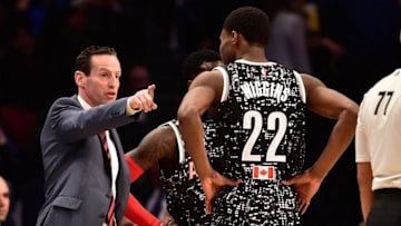 Feb 13, 2015; New York, NY, USA; World Team head coach Kenny Atkinson of the Atlanta Hawks (left) instructs World Team guard Andrew Wiggins of the Minnesota Timberwolves (22) during the second half against the U.S. Team at Barclays Center. Mandatory Credit: Bob Donnan-USA TODAY Sports
