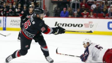 Nov 7, 2014; Raleigh, NC, USA; Carolina Hurricanes forward Elias Lindholm (16) watches his overtime game winner shot score against the Columbus Blue Jackets at PNC Arena. The Carolina Hurricanes defeated the Columbus Blue Jackets 3-2 in overtime. Mandatory Credit: James Guillory-USA TODAY Sports