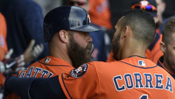 CHICAGO, IL - APRIL 22: Evan Gattis #11 is greeted by Carlos Correa #1 of the Houston Astros after hitting a home run against the Chicago White Sox during the ninth inning on April 22, 2018 at Guaranteed Rate Field in Chicago, Illinois. The Astros won 7-1. (Photo by David Banks/Getty Images)