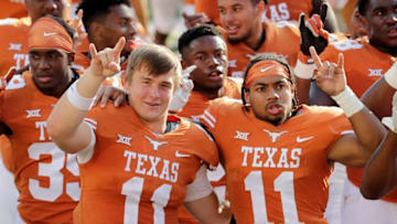 AUSTIN, TX - SEPTEMBER 09: Sam Ehlinger #11 and P.J. Locke III #11 of the Texas Longhorns sing The Eyes of Texas after the game against the San Jose State Spartans at Darrell K Royal-Texas Memorial Stadium on September 9, 2017 in Austin, Texas. (Photo by Tim Warner/Getty Images)