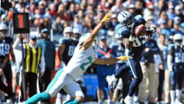 Oct 18, 2015; Nashville, TN, USA; Miami Dolphins cornerback Brent Grimes (21) breaks up a pass intended for Tennessee Titans wide receiver Harry Douglas (83) during the first half at Nissan Stadium. Mandatory Credit: Jim Brown-USA TODAY Sports