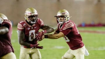 Florida State Seminoles quarterback McKenzie Milton (10) hands the ball off to Florida State Seminoles running back Jashaun Corbin (0).The Notre Dame Fighting Irish defeat the Florida State Seminoles 41-38 at Doak Campbell Stadium on Sunday, Sept. 5, 2021.Fsu V Notre Dame1638