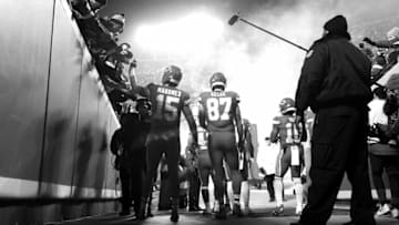 KANSAS CITY, MISSOURI - DECEMBER 13: (EDITORS NOTE: This image has been converted to black and white) Quarterback Patrick Mahomes #15 and tight end Travis Kelce #87 of the Kansas City Chiefs prepare to run onto the field during player introductions prior to the game against the Los Angeles Chargers at Arrowhead Stadium on December 13, 2018 in Kansas City, Missouri. (Photo by Jamie Squire/Getty Images)