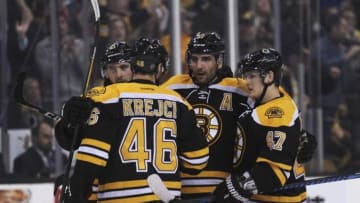 Mar 1, 2016; Boston, MA, USA; Boston Bruins center David Krejci (46) defenseman Torey Krug (47) center Ryan Spooner (51) (left) celebrate a goal by center Patrice Bergeron (37) (middle) during the third period against the Calgary Flames at TD Garden. Mandatory Credit: Bob DeChiara-USA TODAY Sports