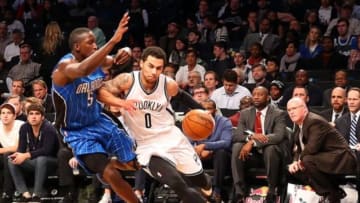Dec 14, 2015; Brooklyn, NY, USA; Brooklyn Nets guard Shane Larkin (0) drives against Orlando Magic guard Victor Oladipo (5) during the fourth quarter at Barclays Center. Orlando Magic won 105-82. Mandatory Credit: Anthony Gruppuso-USA TODAY Sports