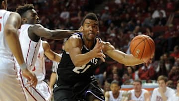 Dec 22, 2014; Norman, OK, USA; Oklahoma Sooners forward Khadeem Lattin (12) guards Weber State Wildcats forward Joel Bolomboy (21) as he drives to the basket during the first half at Lloyd Noble Center. Mandatory Credit: Mark D. Smith-USA TODAY Sports