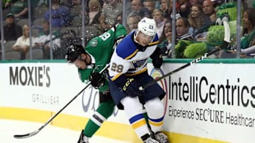 DALLAS, TX - SEPTEMBER 18: Vince Dunn #29 of the St. Louis Blues skates the puck against the Ty Dellandrea #60 of the Dallas Stars during a preseason game at American Airlines Center on September 18, 2018 in Dallas, Texas. (Photo by Ronald Martinez/Getty Images)