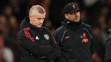 Manchester United's Norwegian manager Ole Gunnar Solskjaer (L) and Liverpool's German manager Jurgen Klopp (R) look on during the English Premier League football match between Manchester United and Liverpool at Old Trafford in Manchester, north west England, on October 24, 2021. - RESTRICTED TO EDITORIAL USE. No use with unauthorized audio, video, data, fixture lists, club/league logos or 'live' services. Online in-match use limited to 120 images. An additional 40 images may be used in extra time. No video emulation. Social media in-match use limited to 120 images. An additional 40 images may be used in extra time. No use in betting publications, games or single club/league/player publications. (Photo by Oli SCARFF / AFP) / RESTRICTED TO EDITORIAL USE. No use with unauthorized audio, video, data, fixture lists, club/league logos or 'live' services. Online in-match use limited to 120 images. An additional 40 images may be used in extra time. No video emulation. Social media in-match use limited to 120 images. An additional 40 images may be used in extra time. No use in betting publications, games or single club/league/player publications. / RESTRICTED TO EDITORIAL USE. No use with unauthorized audio, video, data, fixture lists, club/league logos or 'live' services. Online in-match use limited to 120 images. An additional 40 images may be used in extra time. No video emulation. Social media in-match use limited to 120 images. An additional 40 images may be used in extra time. No use in betting publications, games or single club/league/player publications. (Photo by OLI SCARFF/AFP via Getty Images)
