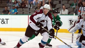 Oct 5, 2016; Dallas, TX, USA; Colorado Avalanche defenseman Chris Bigras (3) keeps the puck away from Dallas Stars center Jason Spezza (90) during the second period at the American Airlines Center. Mandatory Credit: Jerome Miron-USA TODAY Sports