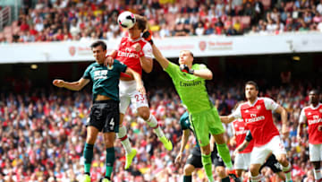 LONDON, ENGLAND - AUGUST 17: David Luiz of Arsenal clrears the ball under pressure from Jack Cork of Burnley during the Premier League match between Arsenal FC and Burnley FC at Emirates Stadium on August 17, 2019 in London, United Kingdom. (Photo by Julian Finney/Getty Images)