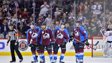 Apr 9, 2016; Denver, CO, USA; Colorado Avalanche defenseman Zach Redmond (22) following his goal skates back to center ice with defenseman Erik Johnson (6) and center Mikhail Grigorenko (25) and center Shawn Matthias (18) in the third period against the Anaheim Ducks at Pepsi Center. The Ducks defeated the Avalanche 5-3. Mandatory Credit: Ron Chenoy-USA TODAY Sports