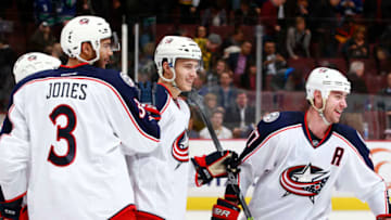 VANCOUVER, BC - FEBRUARY 4: Brandon Dubinsky #17 and Seth Jones #3 celebrate the shootout winning goal by Alexander Wennberg #41 of the Columbus Blue Jackets against the Vancouver Canucks during their NHL game at Rogers Arena February 4, 2016 in Vancouver, British Columbia, Canada. Columbus won 2-1 in a shootout. (Photo by Jeff Vinnick/NHLI via Getty Images)