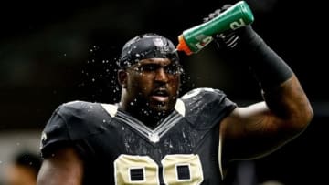 November 5, 2012; New Orleans, LA, USA; New Orleans Saints defensive tackle Sedrick Ellis (98) sprays water on his face prior to kickoff of a game against the Philadelphia Eagles at the Mercedes-Benz Superdome. Mandatory Credit: Derick E. Hingle-USA TODAY Sports