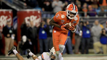 CHARLOTTE, NORTH CAROLINA - DECEMBER 07: Heskin Smith #23 of the Virginia Cavaliers watches as Tee Higgins #5 of the Clemson Tigers catches a touchdown during the ACC Football Championship game at Bank of America Stadium on December 07, 2019 in Charlotte, North Carolina. (Photo by Streeter Lecka/Getty Images)