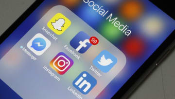 PARIS, FRANCE - MAY 12: In this photo illustration, logos of the Snapchat, Facebook, Twitter, Messenger, Instagram and LinkedIn applications are displayed on the screen of an Apple iPhone on May 12, 2018 in Paris, France. Faced with the anger of dissatisfied users, the Snapchat application has canceled certain changes, announced at the end of 2017, in the presentation of the application, announced its parent company Snap Friday. Snap, which accumulates the financial losses, announced last November a redesign of this app popular with teenagers to attract new users and advertisers. Snapchat is a free photo and video sharing application available on iOS and Android mobile platforms from Snap Inc. (Photo Illustration by Chesnot/Getty Images)