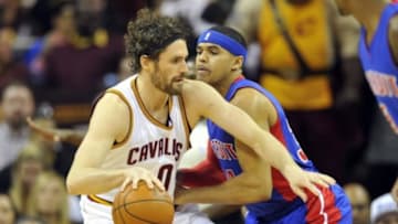Feb 22, 2016; Cleveland, OH, USA; Cleveland Cavaliers forward Kevin Love (0) dribbles against Detroit Pistons forward Tobias Harris (34) in the first quarter at Quicken Loans Arena. Mandatory Credit: David Richard-USA TODAY Sports