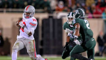 Nov 8, 2014; East Lansing, MI, USA; Ohio State Buckeyes quarterback J.T. Barrett (16) runs the ball during the 2nd half of a game at Spartan Stadium. Mandatory Credit: Mike Carter-USA TODAY Sports
