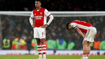 Arsenal's Brazilian defender Gabriel (L) and Arsenal's Scottish defender Kieran Tierney (R) react at the end of the game during the English League Cup semi-final second leg football match between Arsenal and Liverpool at the Emirates Stadium, in London on January 20, 2022. - Liverpool won the game 2-0. - RESTRICTED TO EDITORIAL USE. No use with unauthorized audio, video, data, fixture lists, club/league logos or 'live' services. Online in-match use limited to 45 images, no video emulation. No use in betting, games or single club/league/player publications. (Photo by Ian KINGTON / IKIMAGES / AFP) / RESTRICTED TO EDITORIAL USE. No use with unauthorized audio, video, data, fixture lists, club/league logos or 'live' services. Online in-match use limited to 45 images, no video emulation. No use in betting, games or single club/league/player publications. / RESTRICTED TO EDITORIAL USE. No use with unauthorized audio, video, data, fixture lists, club/league logos or 'live' services. Online in-match use limited to 45 images, no video emulation. No use in betting, games or single club/league/player publications. (Photo by IAN KINGTON/IKIMAGES/AFP via Getty Images)