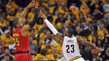 May 2, 2016; Cleveland, OH, USA; Atlanta Hawks center Al Horford (15) shoots as Cleveland Cavaliers forward LeBron James (23) defends during the second quarter in game one of the second round of the NBA Playoffs at Quicken Loans Arena. Mandatory Credit: Ken Blaze-USA TODAY Sports