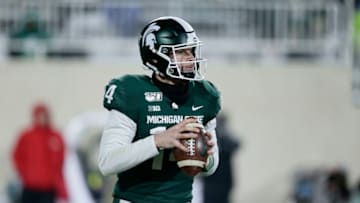 EAST LANSING, MI - NOVEMBER 30: Quarterback Brian Lewerke #14 of the Michigan State Spartans drops back to pass against the Maryland Terrapins during the second half at Spartan Stadium on November 30, 2019, in East Lansing, Michigan. (Photo by Duane Burleson/Getty Images)