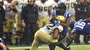 DURHAM, NC - OCTOBER 08: Joe Giles-Harris #44 of the Duke Blue Devils tries to tackle Tyler Campbell #22 of the Army Black Knights during a kickoff return at Wallace Wade Stadium on October 8, 2016 in Durham, North Carolina. (Photo by Lance King/Getty Images)