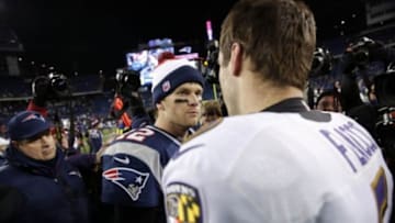 Jan 20, 2013; Foxboro, MA, USA; New England Patriots quarterback Tom Brady (12) greets Baltimore Ravens quarterback Joe Flacco (5) after the AFC championship game at Gillette Stadium. The Ravens won 28-13. Mandatory Credit: David Butler II-USA TODAY Sports