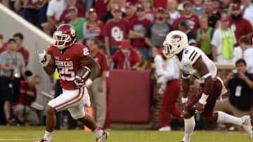 Sep 10, 2016; Norman, OK, USA; Oklahoma Sooners running back Joe Mixon (25) runs the ball against Louisiana Monroe Warhawks safety Wesley Thompson (6) during the second quarter at Gaylord Family - Oklahoma Memorial Stadium. Mandatory Credit: Mark D. Smith-USA TODAY Sports