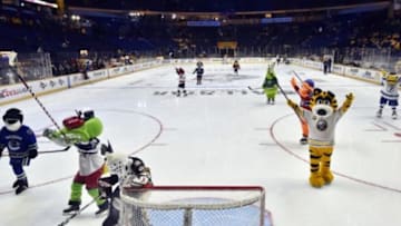 Jan 30, 2016; Nashville, TN, USA; Mascots celebrate after a goal in the NHL Mascot Challenge before the 2016 NHL All Star Game Skills Competition at Bridgestone Arena. Mandatory Credit: Christopher Hanewinckel-USA TODAY Sports