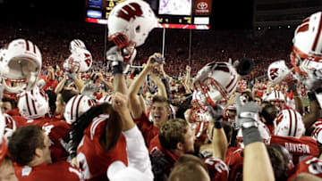 Students and Badger fans rush the field after the University of Wisconsin upset the number 1 ranked Ohio State Buckeyes at Camp Randall Stadium 31-18 in Madison WI Saturday October 16, 2010.Uwgrid17 Spt Lynn 17