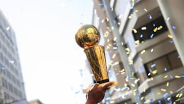 OAKLAND, CA - JUNE 12: the Larry O'Brien Championship trophy is hoisted into the air during the Golden State Warriors Victory Parade on June 12, 2018 in Oakland, California. The Golden State Warriors beat the Cleveland Cavaliers 4-0 to win the 2018 NBA Finals. NOTE TO USER: User expressly acknowledges and agrees that, by downloading and or using this photograph, user is consenting to the terms and conditions of Getty Images License Agreement. Mandatory Copyright Notice: Copyright 2018 NBAE (Photo by Josh Leung/NBAE via Getty Images)