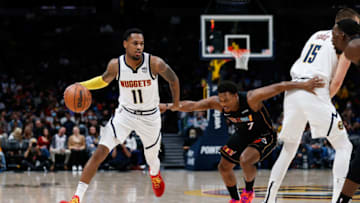 Denver Nuggets guard Monte Morris (11) dribbles the ball as center Nikola Jokic (15) screens against Miami Heat guard Kyle Lowry (7)(Isaiah J. Downing-USA TODAY Sports)