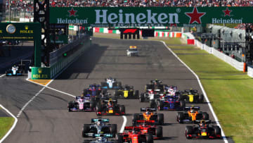 SUZUKA, JAPAN - OCTOBER 13: Valtteri Bottas driving the (77) Mercedes AMG Petronas F1 Team Mercedes W10 leads Sebastian Vettel of Germany driving the (5) Scuderia Ferrari SF90 and the rest of the field at the start during the F1 Grand Prix of Japan at Suzuka Circuit on October 13, 2019 in Suzuka, Japan. (Photo by Mark Thompson/Getty Images)
