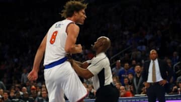 Jan 22, 2016; New York, NY, USA; Referee Dedric Taylor (21) stops New York Knicks center Robin Lopez (8) from going after Los Angeles Clippers players during second half at Madison Square Garden. Mandatory Credit: Noah K. Murray-USA TODAY Sports