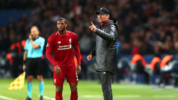 PARIS, FRANCE - NOVEMBER 28: Jurgen Klopp, Manager of Liverpool speaks to Georginio Wijnaldum of Liverpool during the UEFA Champions League Group C match between Paris Saint-Germain and Liverpool at Parc des Princes on November 28, 2018 in Paris, France. (Photo by Clive Rose/Getty Images)
