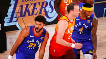 LAKE BUENA VISTA, FLORIDA - AUGUST 08: Jamal Murray #27 of the Denver Nuggets reacts after a basket with Torrey Craig #3 of the Denver Nuggets and as Joe Ingles #2 of the Utah Jazz looks on during the fourth quarter at The Arena at ESPN Wide World Of Sports Complex on August 08, 2020 in Lake Buena Vista, Florida. NOTE TO USER: User expressly acknowledges and agrees that, by downloading and or using this photograph, User is consenting to the terms and conditions of the Getty Images License Agreement. (Photo by Kevin C. Cox/Getty Images)
