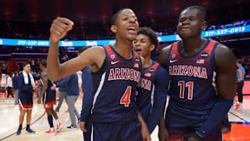 Dec 11, 2021; Champaign, Illinois, USA; Arizona Wildcats players celebrate their team’s 83-79 win over the Illinois fighting Illini at State Farm Center. Mandatory Credit: Ron Johnson-USA TODAY Sports
