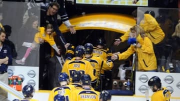Mar 21, 2015; Nashville, TN, USA; Nashville Predators players are congratulated by fans after a win against the Buffalo Sabres at Bridgestone Arena. The Predators won 3-0. Mandatory Credit: Christopher Hanewinckel-USA TODAY Sports