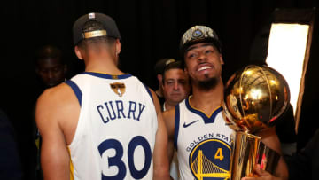 CLEVELAND,OH - Quinn Cook #4 of the Golden State Warriors holds the Larry O'Brien Championship trophy after defeating the Cleveland Cavaliers n Game Four of the 2018 NBA Finals on June 8, 2018 at Quicken Loans Arena in Cleveland, Ohio. NOTE TO USER: User expressly acknowledges and agrees that, by downloading and/or using this photograph, user is consenting to the terms and conditions of the Getty Images License Agreement. Mandatory Copyright Notice: Copyright 2018 NBAE (Photo by Joe Murphy/NBAE via Getty Images)