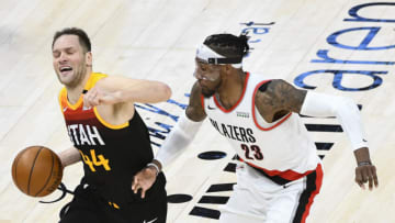 SALT LAKE CITY, UTAH - MAY 12: Bojan Bogdanovic #44 of the Utah Jazz drives into Robert Covington #23 of the Portland Trail Blazers during a game at Vivint Smart Home Arena on May 12, 2021 in Salt Lake City, Utah. NOTE TO USER: User expressly acknowledges and agrees that, by downloading and/or using this photograph, user is consenting to the terms and conditions of the Getty Images License Agreement. (Photo by Alex Goodlett/Getty Images)