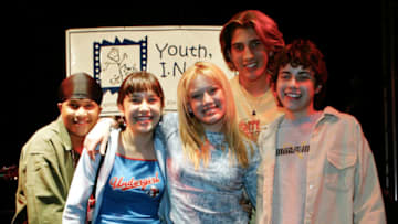 401763 10: Actress Hilary Duff (C) and the cast of the television series Lizzie McGuire pose for photographers at the Youth, Improving Non-Profit for Children Awards March 4, 2002 in Los Angeles, CA. Former NBA basketball player Earvin "Magic" Johnson, actor Jim Belushi and former boxer Sugar Ray Leonard were honored at the event. (Photo by Frederick M. Brown/Getty Images)