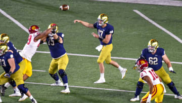 Oct 23, 2021; South Bend, Indiana, USA; Notre Dame Fighting Irish quarterback Jack Coan (17) throws a pass against the USC Trojans in the first quarter at Notre Dame Stadium. Mandatory Credit: Matt Cashore-USA TODAY Sports