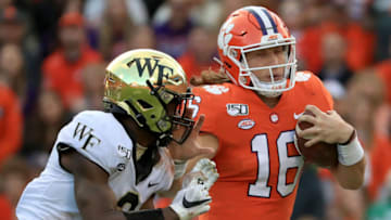 CLEMSON, SOUTH CAROLINA - NOVEMBER 16: Nasir Greer #3 of the Wake Forest Demon Deacons goes after Trevor Lawrence #16 of the Clemson Tigers during their game at Memorial Stadium on November 16, 2019 in Clemson, South Carolina. (Photo by Streeter Lecka/Getty Images)