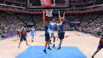 SACRAMENTO, CA - DECEMBER 19: De'Aaron Fox #5 of the Sacramento Kings goes up for the shot against Nerlens Noel #3 of the Oklahoma City Thunder on December 19, 2018 at Golden 1 Center in Sacramento, California. NOTE TO USER: User expressly acknowledges and agrees that, by downloading and or using this photograph, User is consenting to the terms and conditions of the Getty Images Agreement. Mandatory Copyright Notice: Copyright 2018 NBAE (Photo by Rocky Widner/NBAE via Getty Images)