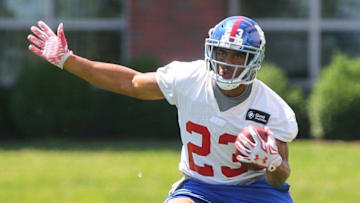 Jun 6, 2016; East Rutherford, NJ, USA; New York Giants running back Rashad Jennings (23) runs with the ball during organized team activities at Quest Diagnostics Training Center. Mandatory Credit: Ed Mulholland-USA TODAY Sports
